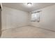 Simple carpeted bedroom with window and closet at 721 Aspen Way, Evergreen, CO 80439