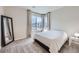 Bright bedroom with a large window and neutral decor for a serene atmosphere at 6153 N Ceylon St # 2-202, Denver, CO 80249