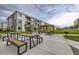 A well-maintained community area with picnic tables and BBQ grill, ideal for outdoor gatherings at 6153 N Ceylon St # 2-202, Denver, CO 80249