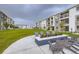 Inviting community firepit area with comfortable seating, perfect for relaxing outdoors at 6153 N Ceylon St # 2-202, Denver, CO 80249