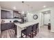Stylish kitchen featuring granite countertops, modern appliances, and a breakfast bar with seating at 6153 N Ceylon St # 2-202, Denver, CO 80249