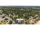 Aerial view showing the house and surrounding neighborhood with green spaces at 4600 W Princeton Ave, Denver, CO 80236