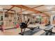 Fully equipped home gym with rowing machine and weight rack at 4600 W Princeton Ave, Denver, CO 80236