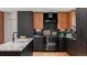 Modern kitchen with stainless steel appliances and dark cabinetry at 4600 W Princeton Ave, Denver, CO 80236