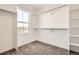 Walk-in closet with shelving and clothing rods, offering ample storage space and a window at 11008 Snowdon St, Parker, CO 80134