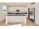 Modern kitchen with white cabinets, stainless steel appliances, granite countertops, and a center island at 11008 Snowdon St, Parker, CO 80134