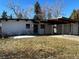 Charming single-story home featuring a carport, modern design, and a well-maintained lawn at 330 W Fair Ave, Littleton, CO 80120