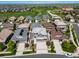 Aerial view of a residential neighborhood, with golf course and green space in the background at 7720 S Queensburg Way, Aurora, CO 80016