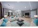 Bright and spacious basement living area with plush carpeting, recessed lighting, and comfortable seating at 7720 S Queensburg Way, Aurora, CO 80016