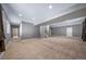 Expansive basement featuring neutral carpet, recessed lighting, and ample space for versatile use at 7720 S Queensburg Way, Aurora, CO 80016