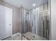 Elegant bathroom featuring a glass-enclosed shower with stylish tile and modern fixtures at 7720 S Queensburg Way, Aurora, CO 80016