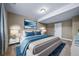 Comfortable bedroom with a queen bed, soft carpeting, and a serene atmosphere at 7720 S Queensburg Way, Aurora, CO 80016