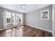 Bright bedroom with wood floors and large windows providing ample natural light at 7720 S Queensburg Way, Aurora, CO 80016