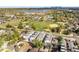 Aerial view shows the townhome's proximity to a gorgeous lake and a community park at 1615 Harlan St # 2, Lakewood, CO 80214