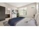 Stylishly furnished bedroom with a bathroom, natural light, and decor at 1615 Harlan St # 2, Lakewood, CO 80214