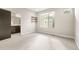 Bright bedroom with carpet, large windows, closet, and a glimpse of a bathroom at 1615 Harlan St # 2, Lakewood, CO 80214