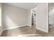 Minimalist bedroom featuring modern flooring and a walk-in closet at 1615 Harlan St # 2, Lakewood, CO 80214