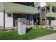 Modern townhome with well-kept lawn and unique address post at 1615 Harlan St # 2, Lakewood, CO 80214