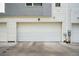 Attached two-car garage with a clean, modern design and ample parking space at 1615 Harlan St # 2, Lakewood, CO 80214