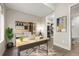 Cozy home office with stylish shelving, a desk, and an adjacent closet at 1615 Harlan St # 2, Lakewood, CO 80214