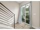 Bright staircase featuring modern railing and plenty of light from the sliding glass doors at 1615 Harlan St # 2, Lakewood, CO 80214