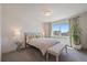 Bright bedroom with large window, bench, and neutral decor for a relaxing atmosphere at 1100 Blue Bell Rd, Berthoud, CO 80513