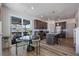 Modern kitchen with stainless steel appliances, granite countertops, wooden cabinets and a sliding door to the patio at 1100 Blue Bell Rd, Berthoud, CO 80513