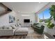 Comfortable living room with ample natural light, modern furnishings, stylish decor, and hardwood floors at 1100 Blue Bell Rd, Berthoud, CO 80513
