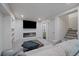 Comfortable living room boasts modern fireplace, plush seating, and convenient access to a powder room at 1100 Blue Bell Rd, Berthoud, CO 80513