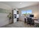 Bright office with large window, modern desk, and built-in shelving at 1100 Blue Bell Rd, Berthoud, CO 80513
