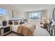 Comfortable bedroom featuring neutral tones, cozy furniture, and lots of natural light at 4102 Estrella St, Brighton, CO 80601