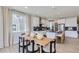 Open dining area with views of the modern kitchen, features bright lighting, and stylish decor for Gathering meals at 4102 Estrella St, Brighton, CO 80601