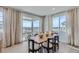 Dining area with a sliding glass door, scenic views, and a stylish dining set, perfect for entertaining at 4102 Estrella St, Brighton, CO 80601