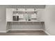 Kitchenette features stainless steel appliances, breakfast bar with modern pendant lights at 5839 Hay Market Trl, Parker, CO 80134