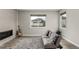 Comfortable living room features a fireplace, a modern couch and neutral decor at 5839 Hay Market Trl, Parker, CO 80134