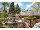 Beautifully landscaped community with a bridge, outdoor seating, and well-maintained walkways at 8500 E Jefferson Ave # 11C, Denver, CO 80237