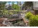 Charming townhome community featuring lush landscaping, a bridge, and serene water features at 8500 E Jefferson Ave # 11C, Denver, CO 80237