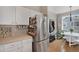 Kitchen with stainless steel refrigerator and ample counter space near the dining area, providing convenience and functionality at 8500 E Jefferson Ave # 11C, Denver, CO 80237