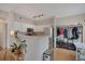 Modern kitchen seamlessly connects to a dining area, complete with stainless steel appliances and hardwood floors at 8500 E Jefferson Ave # 11C, Denver, CO 80237