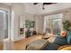 Bright and airy living room with a comfortable sofa, balcony access, and modern decor at 8500 E Jefferson Ave # 11C, Denver, CO 80237