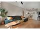Inviting living room with a cozy sofa, hardwood floors, and open access to the kitchen area at 8500 E Jefferson Ave # 11C, Denver, CO 80237