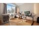 Well-lit home office boasts large windows, hardwood floors, and dual workstations at 8500 E Jefferson Ave # 11C, Denver, CO 80237