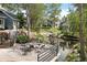 Relaxing patio area with outdoor seating overlooking a serene pond and landscaped community grounds at 8500 E Jefferson Ave # 11C, Denver, CO 80237