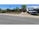 Quaint home displaying a compact front yard with a variety of parked vehicles at 7371 Granada Rd, Denver, CO 80221