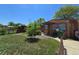 Charming single-story home featuring a well-maintained lawn and cozy front porch at 7371 Granada Rd, Denver, CO 80221