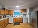 Functional kitchen offering ample cabinetry and modern appliances for cooking at 7371 Granada Rd, Denver, CO 80221