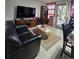 Inviting living room with tile floors, TV, and comfortable seating arrangement at 7371 Granada Rd, Denver, CO 80221