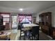 Cozy dining and living area with access to backyard, complemented by tile flooring at 7371 Granada Rd, Denver, CO 80221