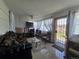 Comfortable living room featuring tile floors and an open view of the front yard at 7371 Granada Rd, Denver, CO 80221
