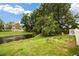 A serene backyard with a pond, lush greenery, and geese, creating a tranquil and picturesque outdoor space at 2856 S Kenton Ct, Aurora, CO 80014